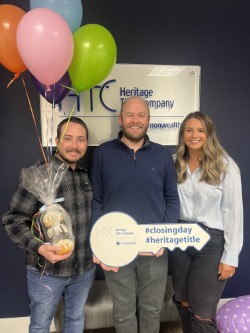 Clients celebrating a home purchase with balloons and their homebuying team