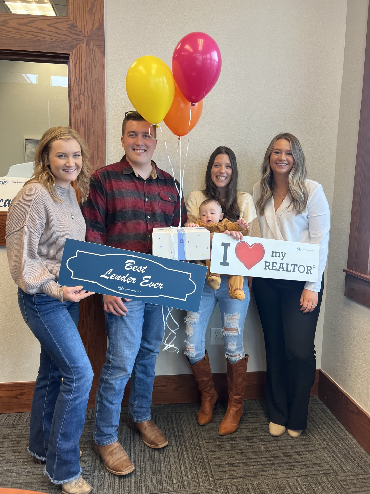 Clients and their homebuying team celebrating closing day