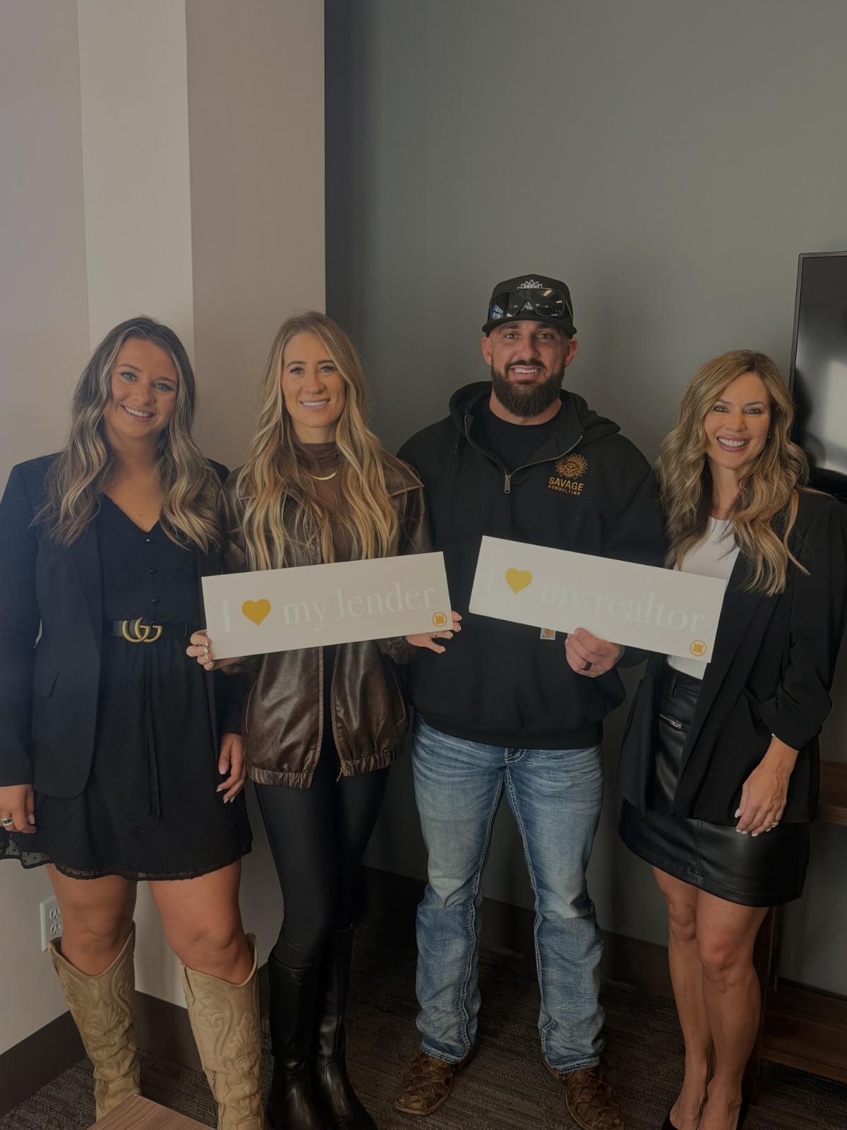 Jordan celebrating with clients and their Realtor partner
